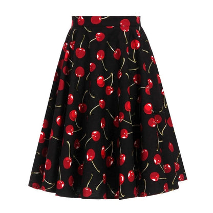 Jupe noire à motif cerises, style années 50, édition vintage charmante, idéale pour un look rétro et féminin. Taille cintrée.