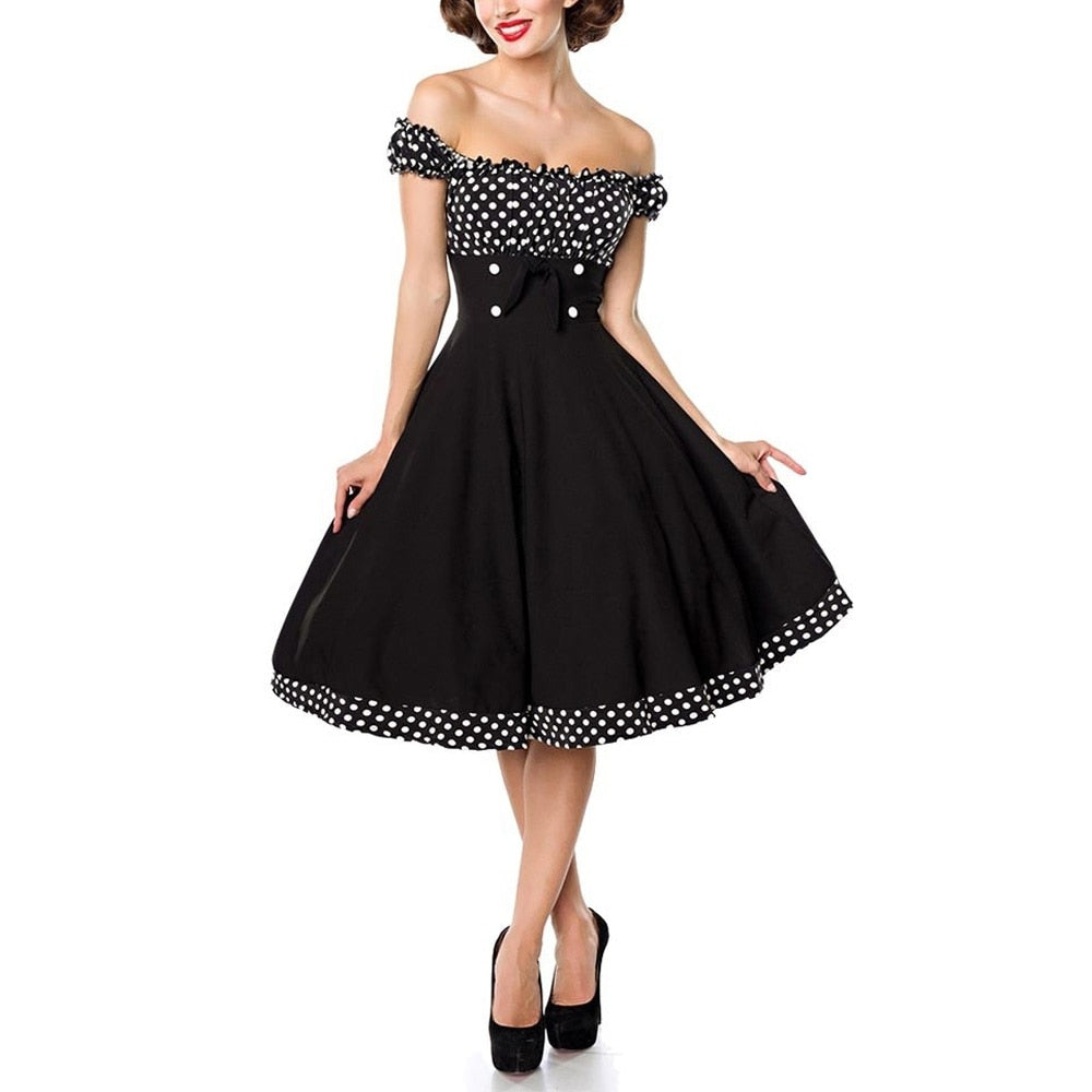 Robe pin-up vintage des années 70, imitant un style glamour avec motifs colorés, cintrée à la taille, parfaite pour les soirées.